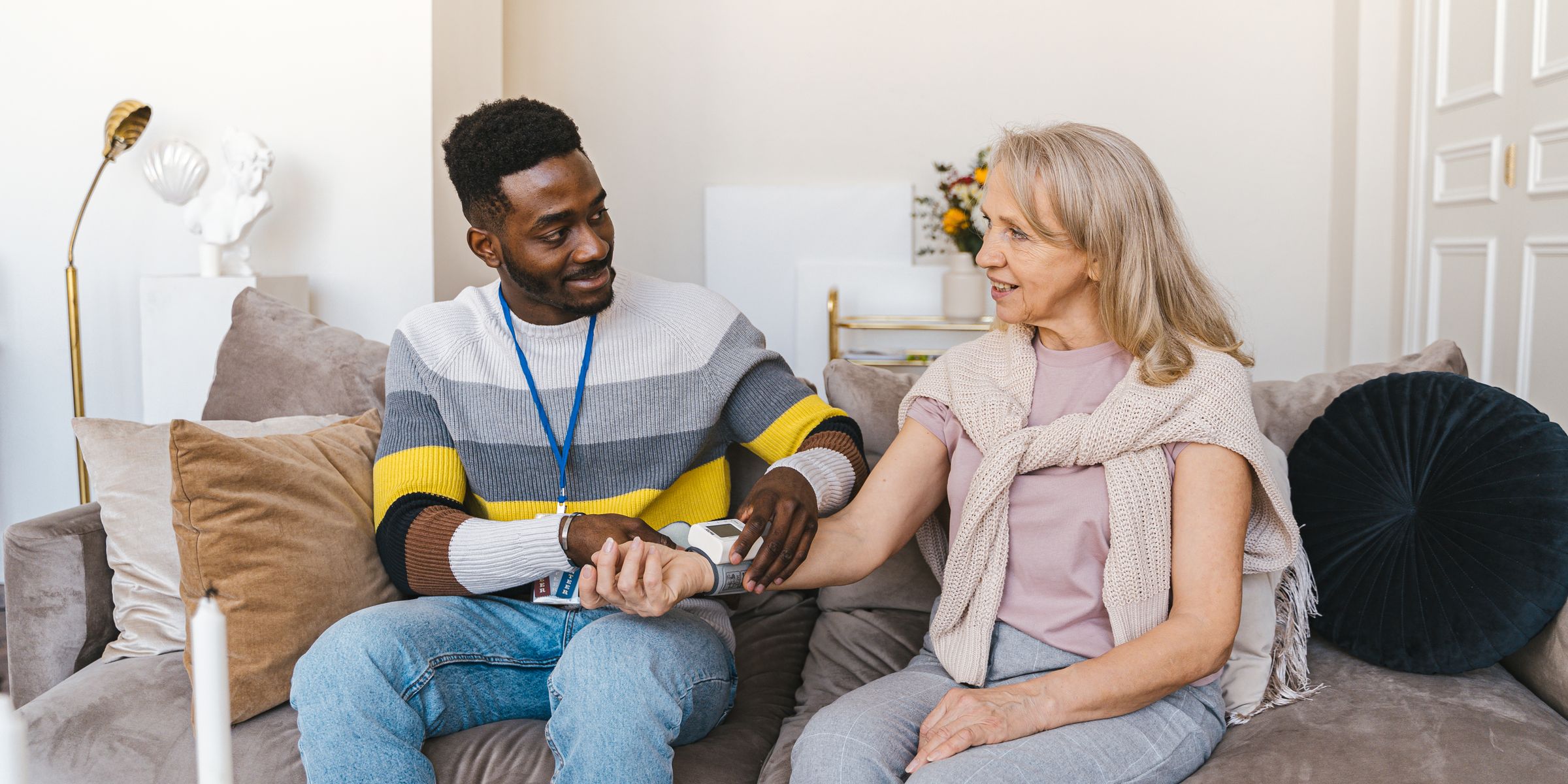 Nurse and patient having a warm conversation during a home visit